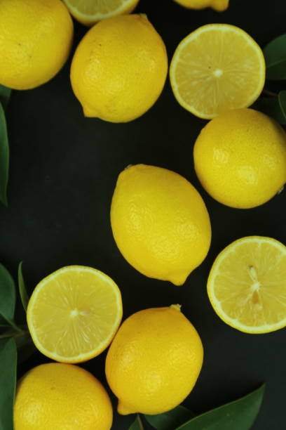 istock Group of lemons with leaves, isolated on background 1293885706