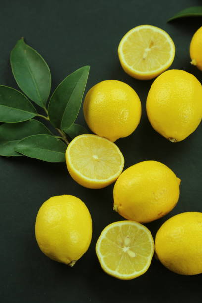 istock Group of lemons with leaves, isolated on background 1293887762