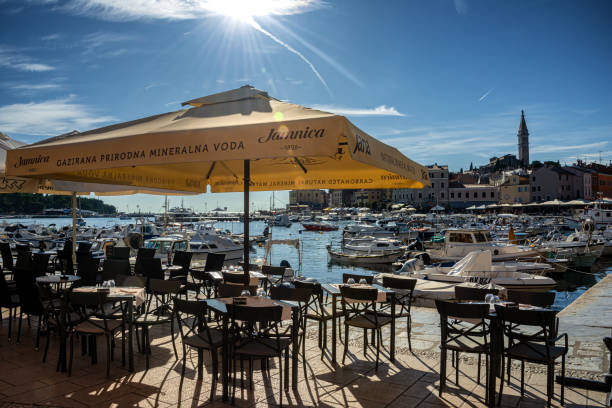 view of cafe and Restaurants in historical center of Rovinj, Croatia ROVINJ, ISTRIA PENINSULA, CROATIA AUG 2019: view of cafe and Restaurants in historical center of Rovinj, Croatia rovinj harbor stock pictures, royalty-free photos & images