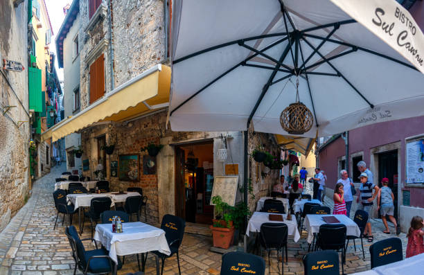 view of cafe and Restaurants in historical center of Rovinj, Croatia ROVINJ, ISTRIA PENINSULA, CROATIA AUG 2019: view of cafe and Restaurants in historical center of Rovinj, Croatia rovinj harbor stock pictures, royalty-free photos & images