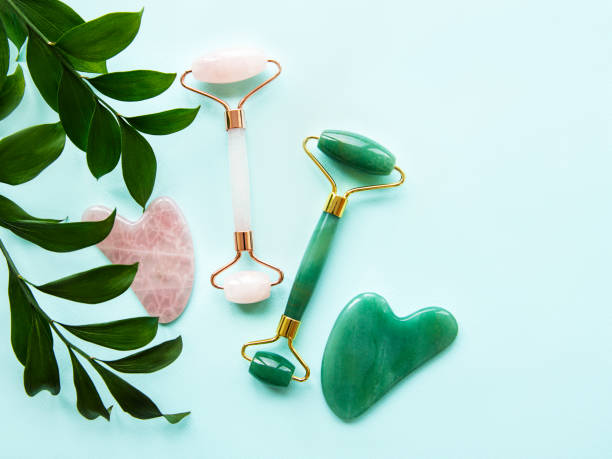 istock Face massage jade roller  on pastel green background 1293888497
