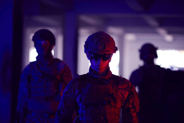 istock soldier squad team walking in urban environment colored lightis 1293888661