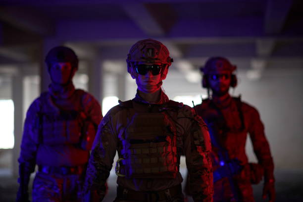 istock soldier squad team walking in urban environment colored lightis 1293890228