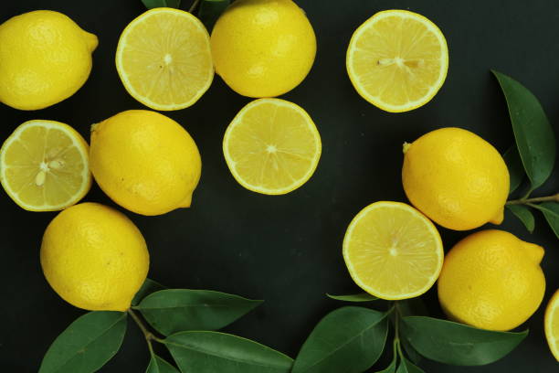istock Group of lemons with leaves, isolated on background 1293890476