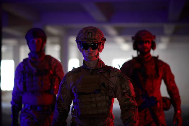 istock soldier squad team walking in urban environment colored lightis 1293891341