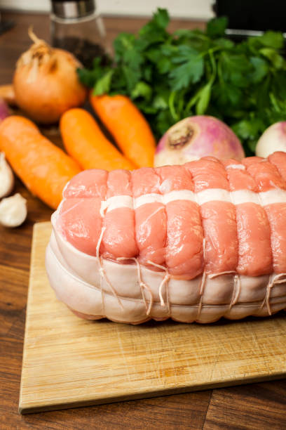 Home cooking, preparation of roast veal with fresh vegetables stock photo