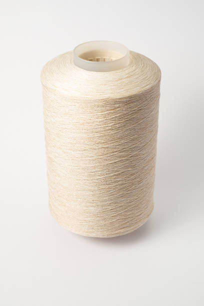 istock bobbin of yarn on a white background. Side view.Textile reel on isolated white background. 1293891395