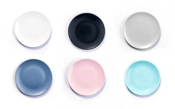 istock Set of six colorful empty plates isolated on white background top view 1293892831