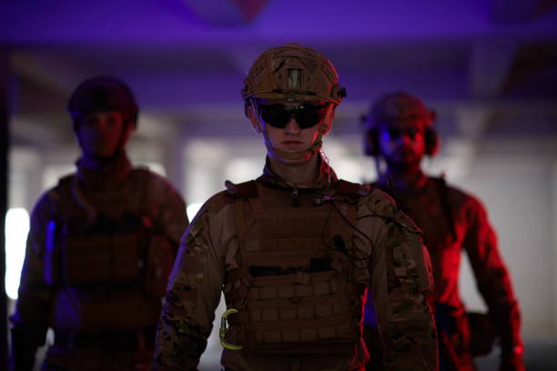 istock soldier squad team walking in urban environment colored lightis 1293893013