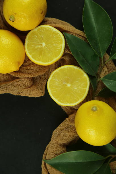 istock Group of lemons with leaves, isolated on background 1293893092