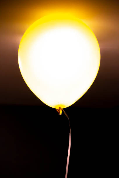 Yellow glowing chinese lanterns in dark for holidays