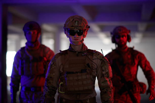istock soldier squad team walking in urban environment colored lightis 1293894056