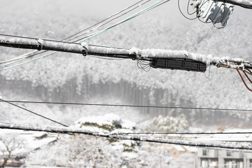 Snow on electricity cables in Kyoto, Japan