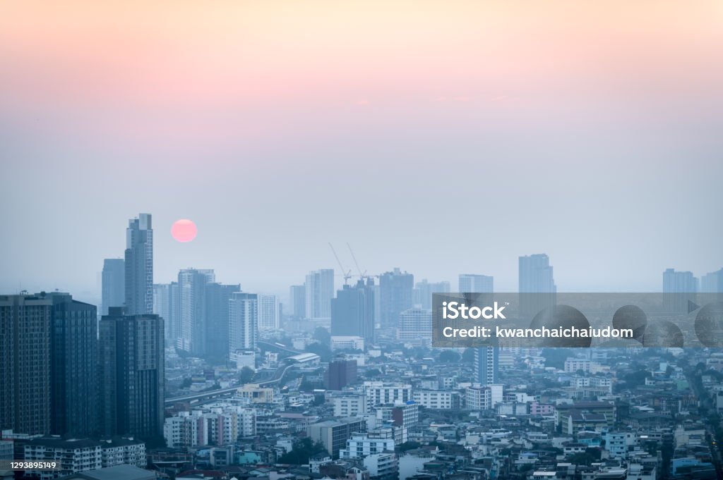 PM 2.5 dust in Bangkok,Capital city are covered by heavy smog, environmental problem PM 2.5 dust in Bangkok,Capital city are covered by heavy smog,Sunset in downtown with bad air pollution, the Place to risk of cancer, environmental problem Bangkok Stock Photo