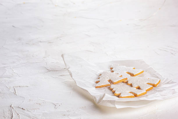 Gingerbread christmas trees on paper napkin, close-up view. Christmas celebration concept with space for text