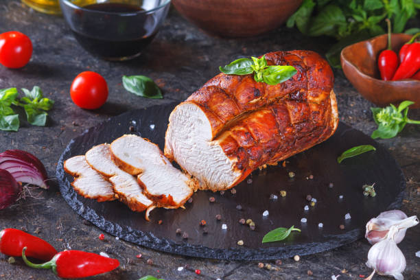 istock omemade sliced roasted turkey fillet with vegetables, closeup 1293895946