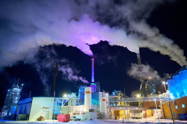 Factory at Night Air Pollution From Industrial Smoke