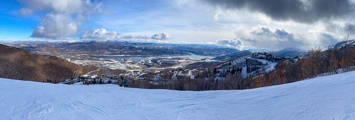Panoramic view of Wasatch mountains with Jordanelle lake. Deer Valley resort.