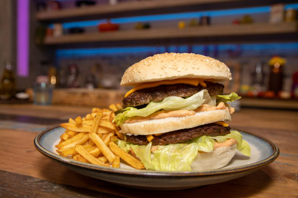 istock A classic home made burger and chips on a wooden table 1293899573