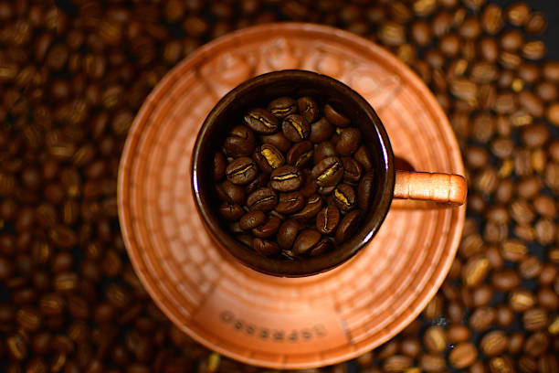 istock Cup filled with coffee beans seen from above 1293900635