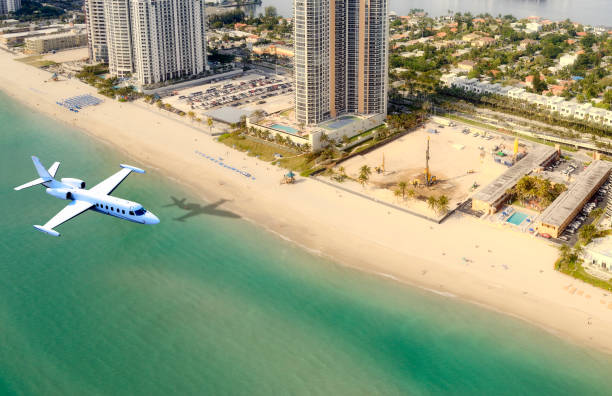 istock Airplane flying to Miami. Aerial View. 1293901238