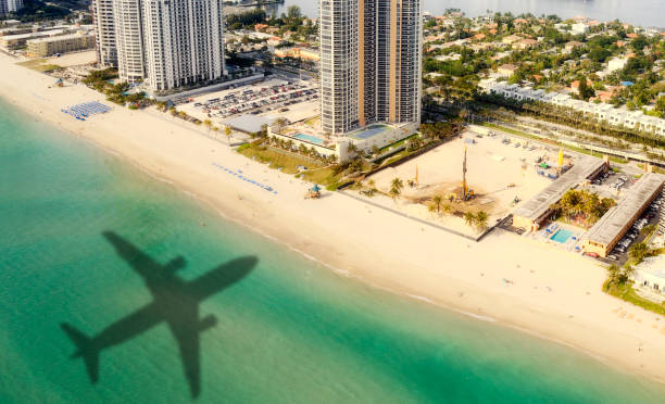 istock Airplane flying to Miami. Aerial View. 1293901245