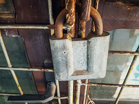 Old rusty padlock on a door