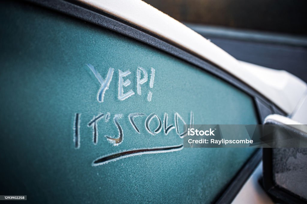 'YEP!..ITS COLD' handwritten on a frosty car windshield Abstract Stock Photo