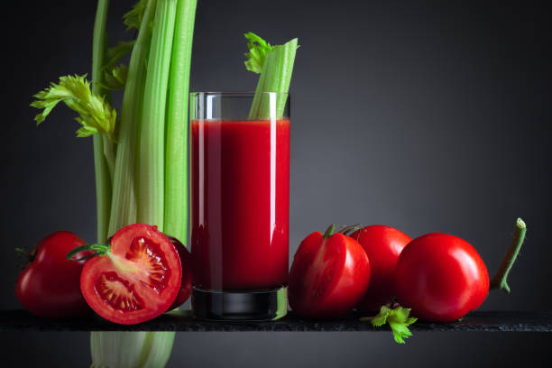 istock Tomato juice with tomatoes and celery sticks 1293905180