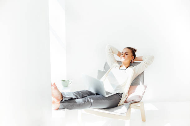 istock Young woman resting with laptop 1293907342