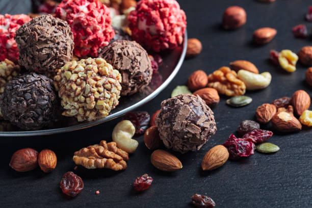 istock Homemade candy with chocolate, nuts and dried berries. 1293911744