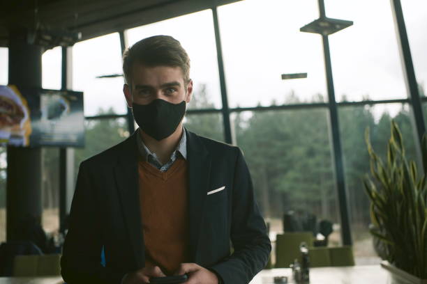 istock business man wearing protective face mask at luxury office 1293911819
