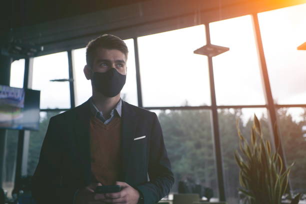 istock business man wearing protective face mask at luxury office 1293912747