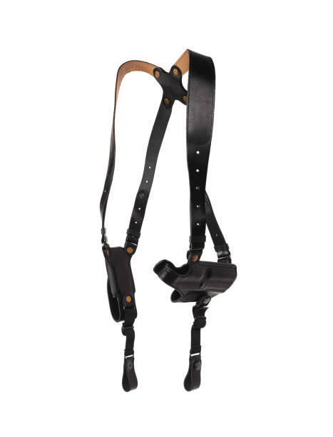 istock Pistol black leather holster with shoulder straps isolate on white background. Weapon accessory. Part of the uniform of the police or guarding. 1293914275
