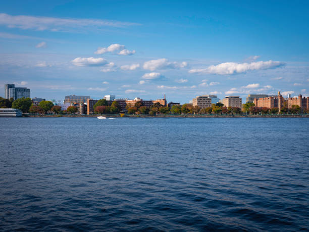 istock Boston Cityscape over the Charles River with Dramatic Clouds on Blue Sky Background 1293916825