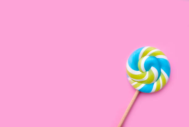 istock spiral candy on colored background, birthday, card 1293917571