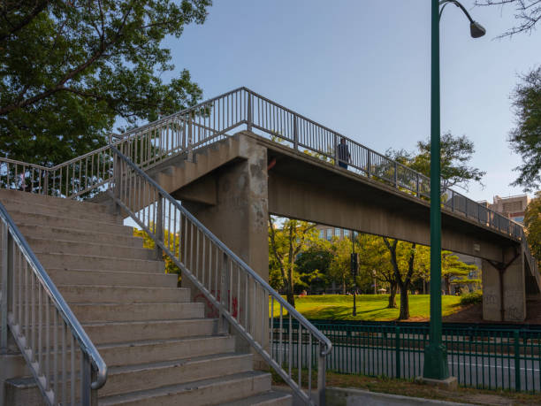 istock Pedestrian Foot Bridge with Street Light 1293919927