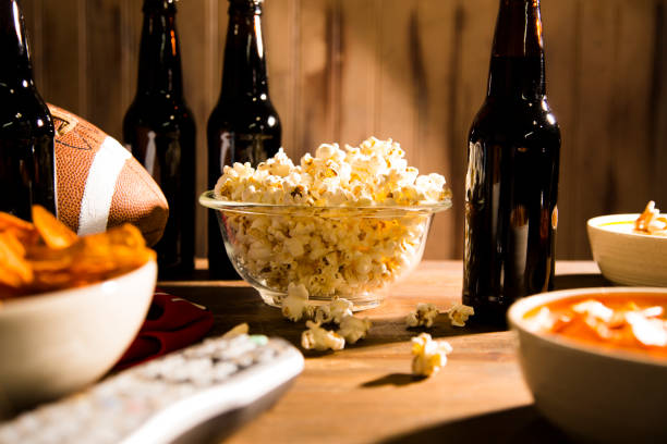 istock Watching the football game with snacks, drinks. 1293923822