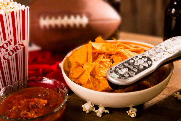 istock Watching the football game with snacks, drinks. 1293923915