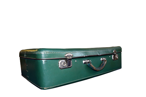 Old vintage suitcase isolated on white background. Green classic travel bag with key. Retro travel briefcase from old days, worn from prolonged use. Transportation and storage of personal household