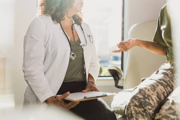 istock Unrecognizable soldier gestures while chatting with female doctor 1293927047