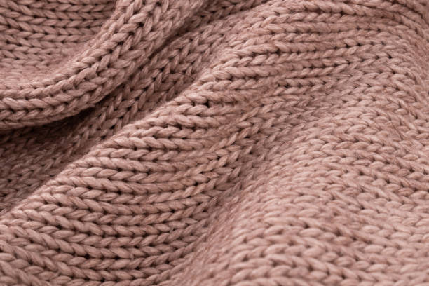 istock Chaotic folds are beautifully arranged on a beige knitted bedspread 1293927743