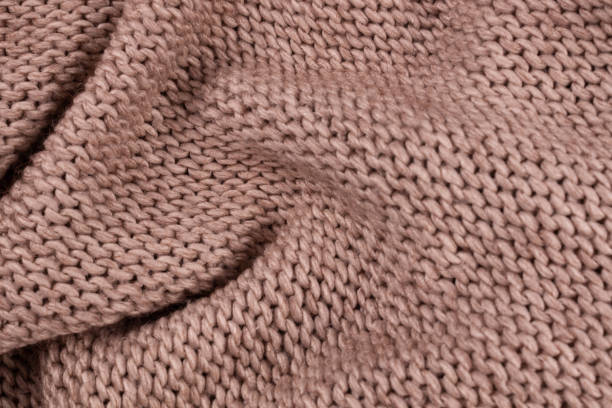 istock Large and small folds are scattered on a bedspread of thread 1293927804