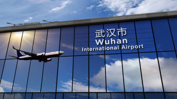 Airplane landing at Wuhan mirrored in terminal