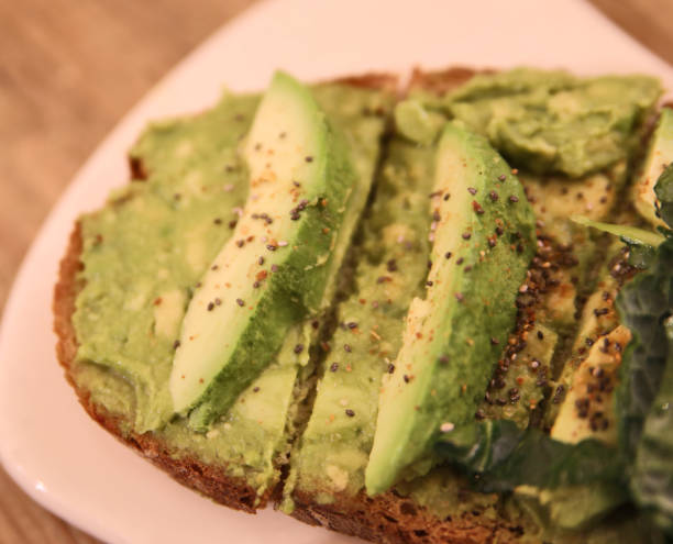 istock Sandwich with avocado and chia seeds on the white plate. 1293930788
