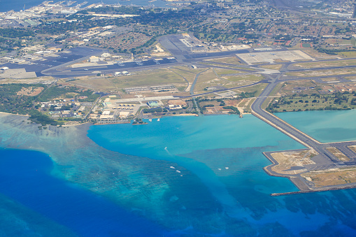 Aerial view of runways of Daniel K. International Airport and Joint Base Pearl Harbor-Hickam in Honolulu, Hawaii