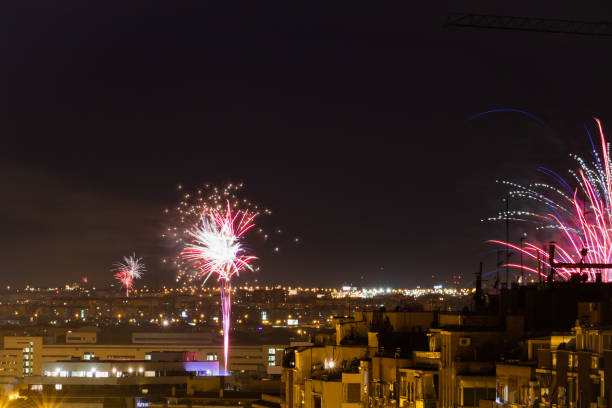 Madrid, Spain; 2021/01/01: People celebrate the new year 2021 with fireworks. This year, due to the COVID-19 pandemic, health restrictions have been imposed limiting meetings between people and a curfew has been established at 1:30 a.m.