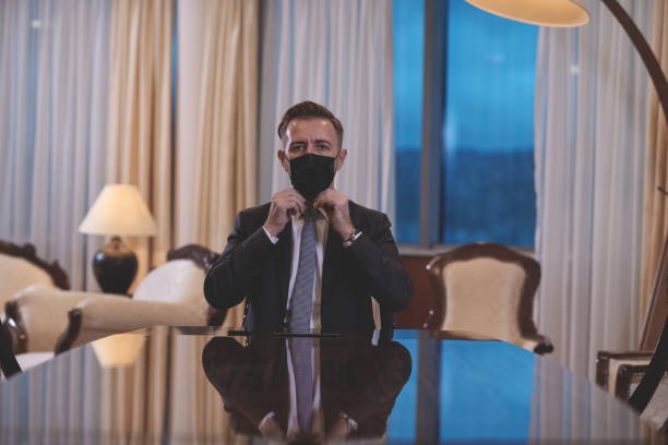 istock business man wearing protective face mask at office 1293944591