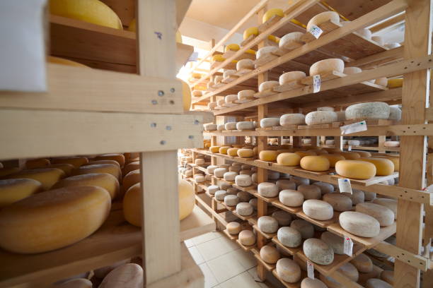 istock Cheese factory production shelves with aging old cheese 1293945183