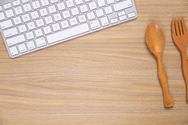 istock Creative Office wood top desk with Computer Keyboard 1293951794
